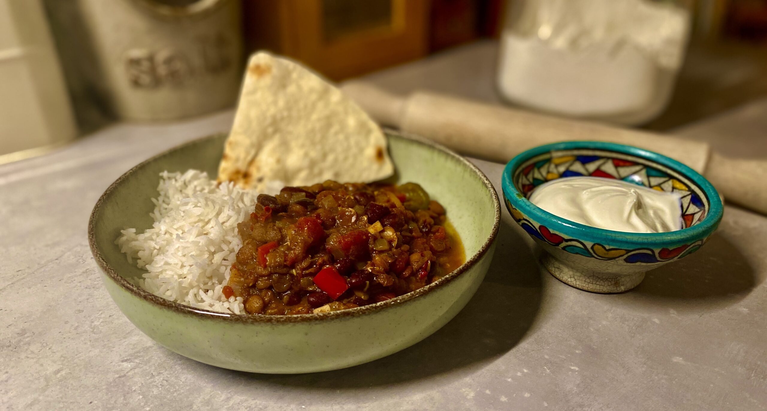 Bowl of veggie mince chilli topped with yogurt